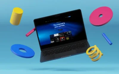 Offener Laptop, umgeben von schwebenden, bunten abstrakten Formen vor hellblauem Hintergrund. Auf dem Laptop-Bildschirm wird eine Website mit der Überschrift „Das Internet ist Ihre Leinwand“ angezeigt.